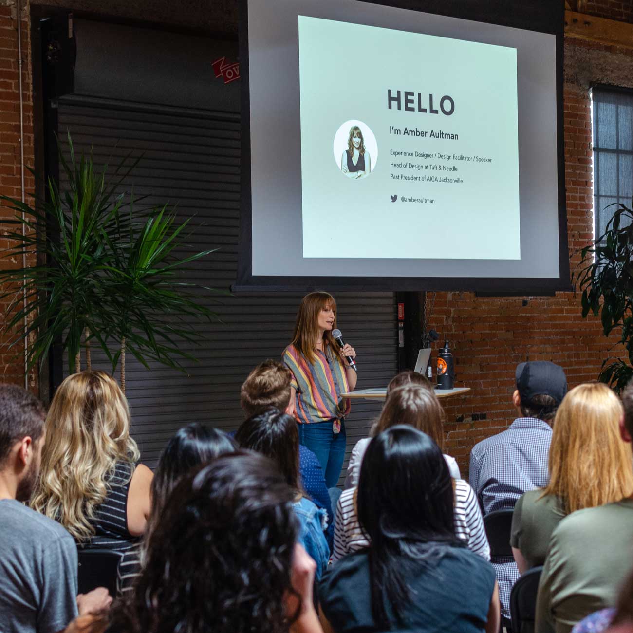 Me, speaking in front of a room full of people at Creative Mornings PHX.