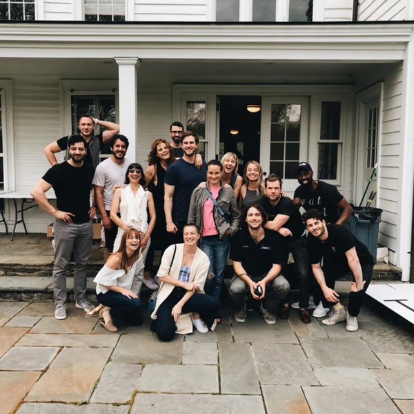 The photoshoot crew stands together for a photo after the shoot.