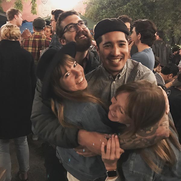 My coworkers and I group hug at a bar in San Francisco.