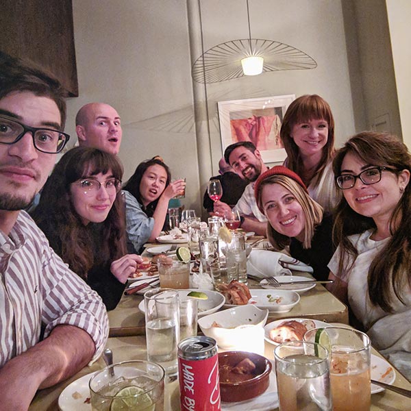 The design team sitting around a table at a restaurant.