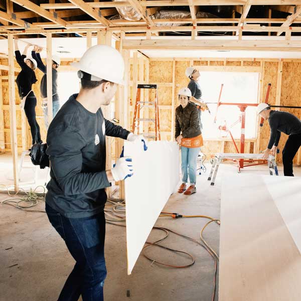 The team and I put up drywall for a new house construction.