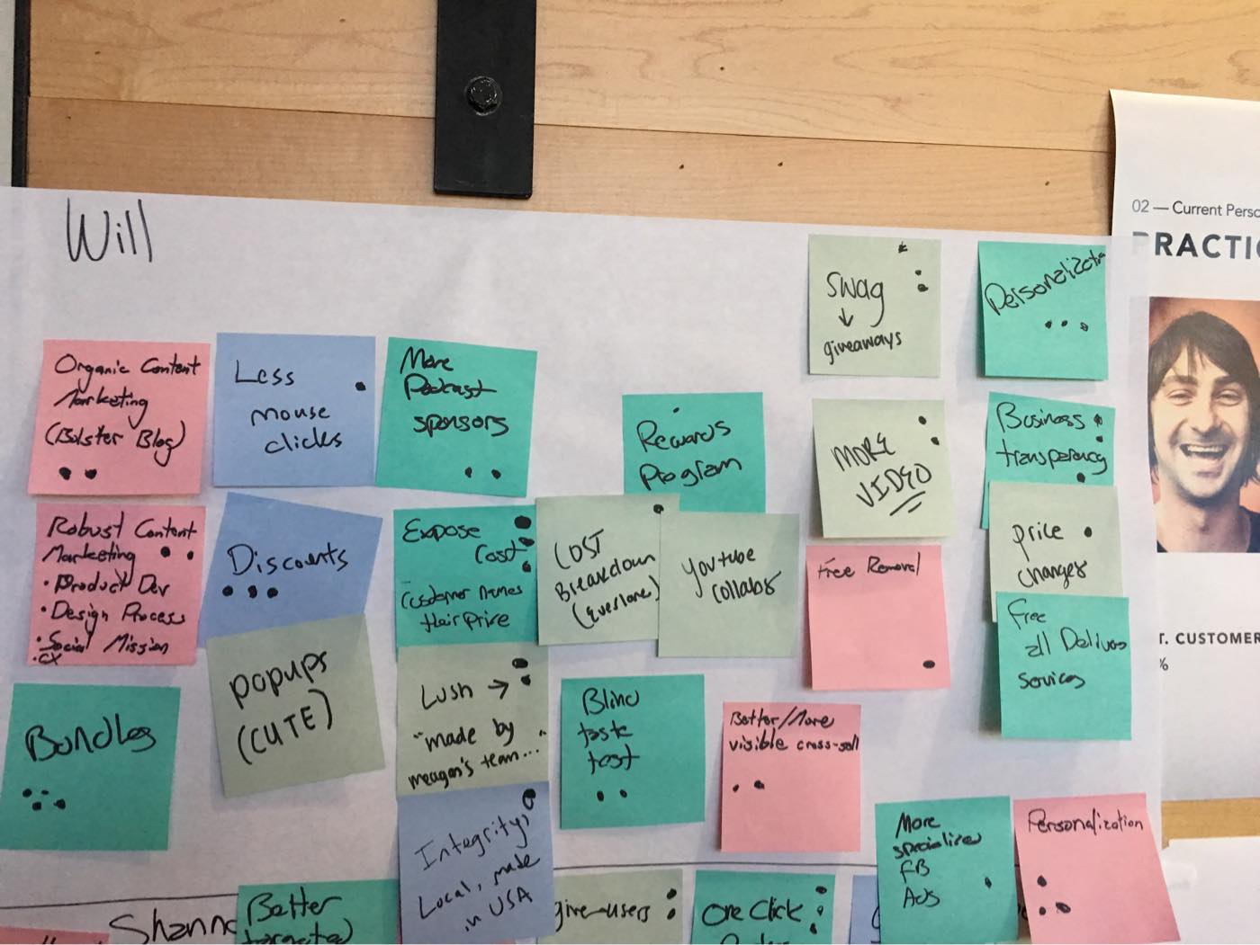 A bunch of sticky notes from a how-might-we ideation session.